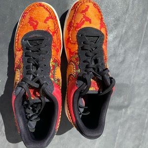 Men’s red and orange Nike Air Force 1 Low,